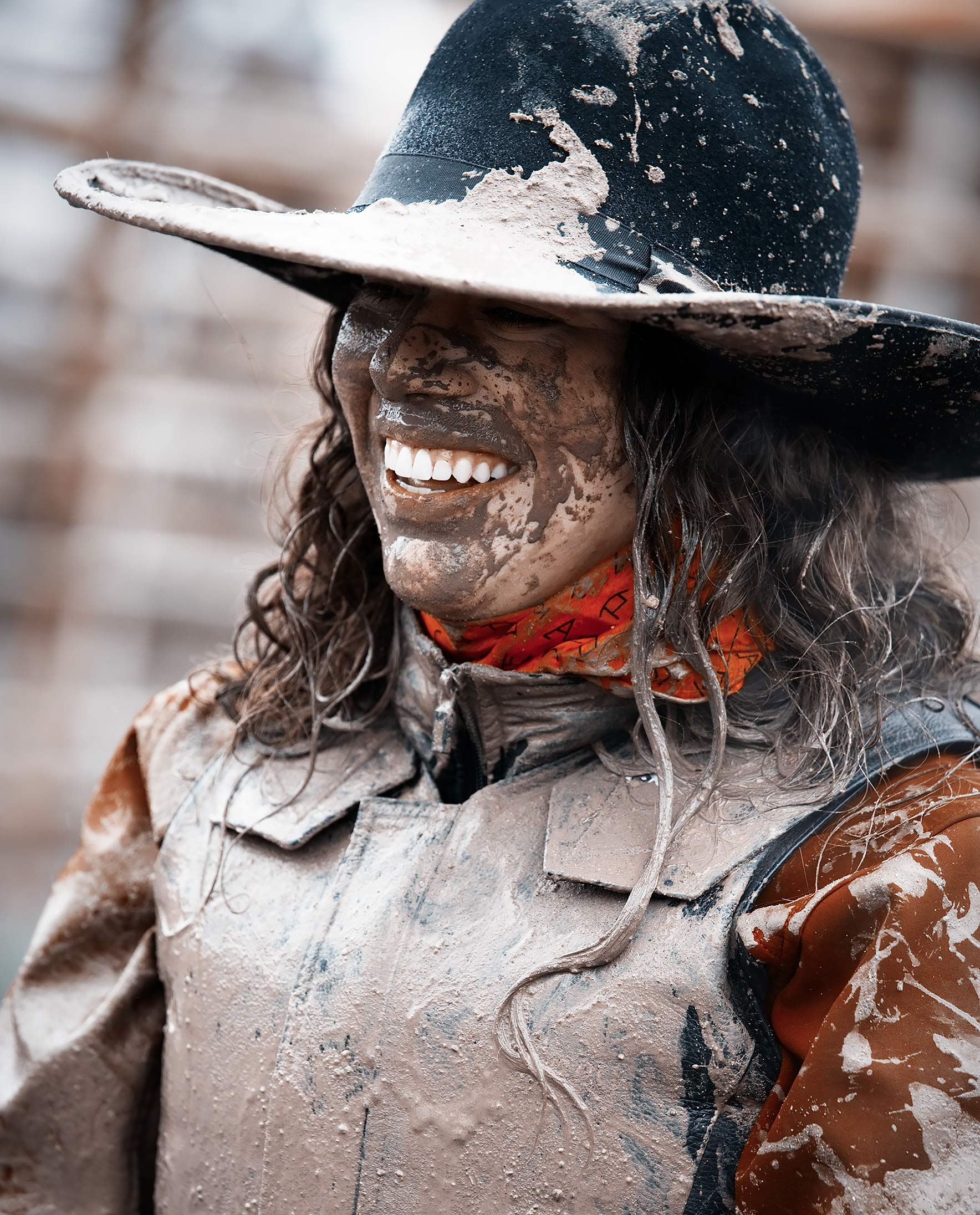 Cowgirl covered in mud