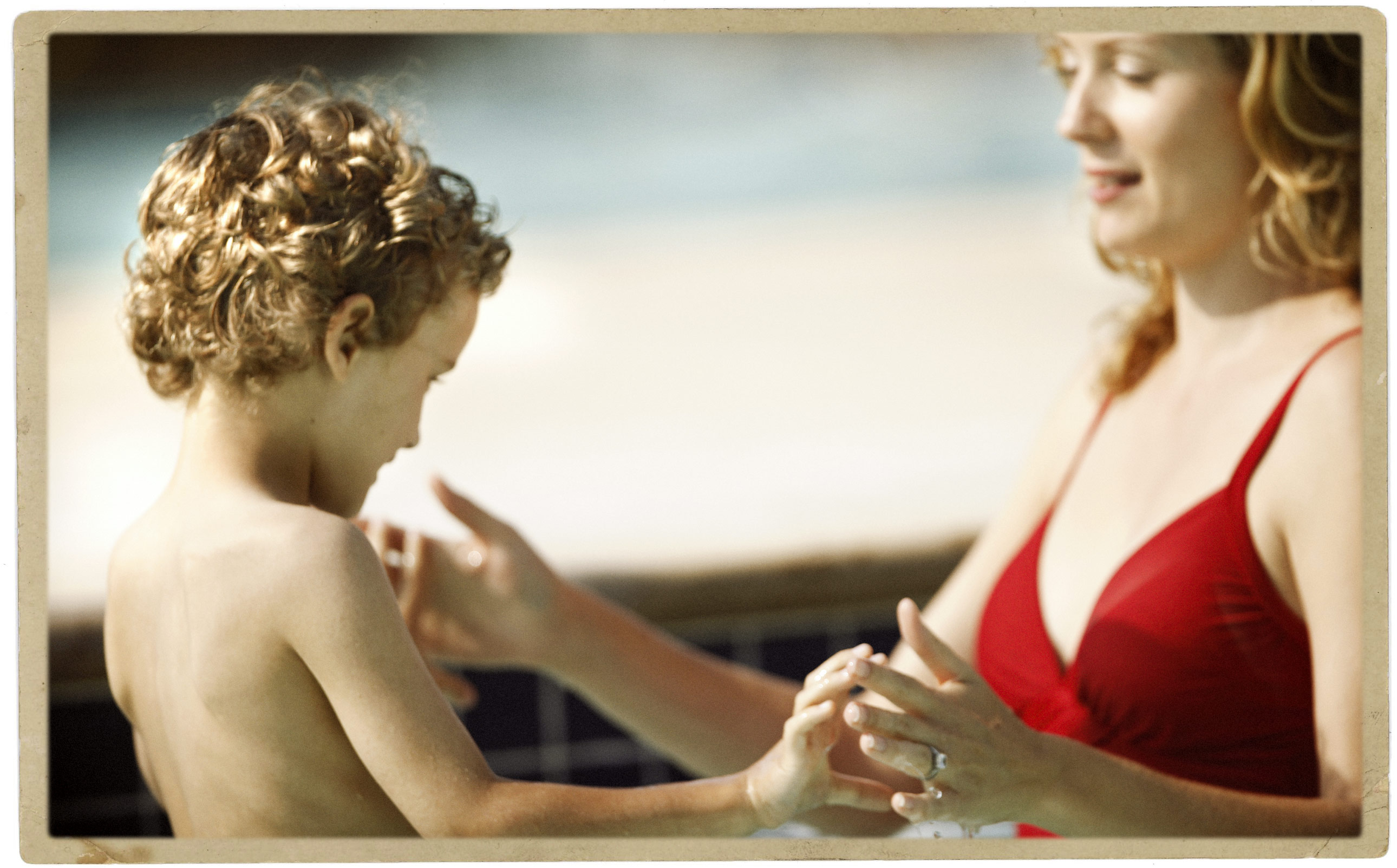 Child with Mother in a Swimming Pool