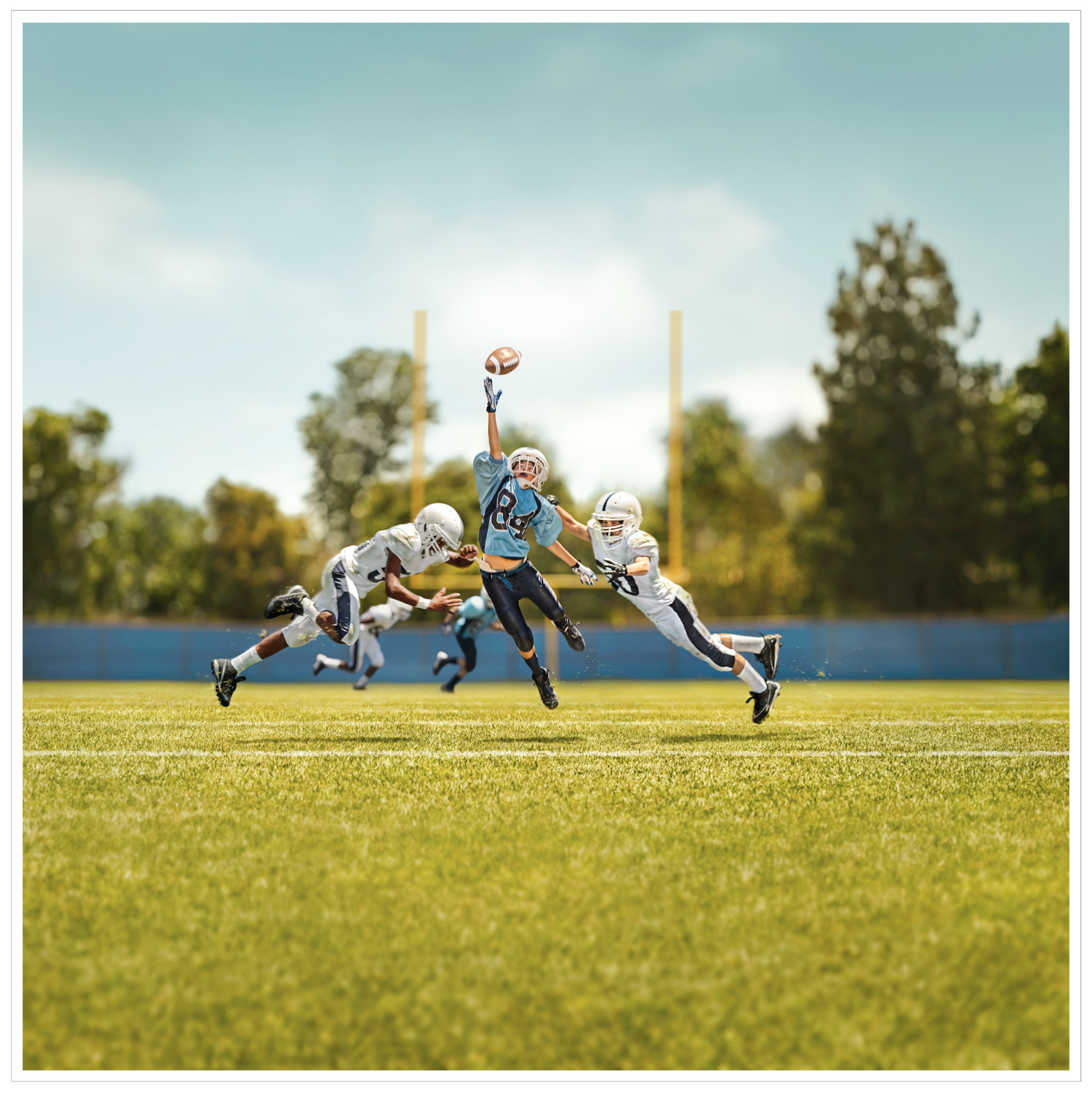 Boys playing football - print campaign for Children