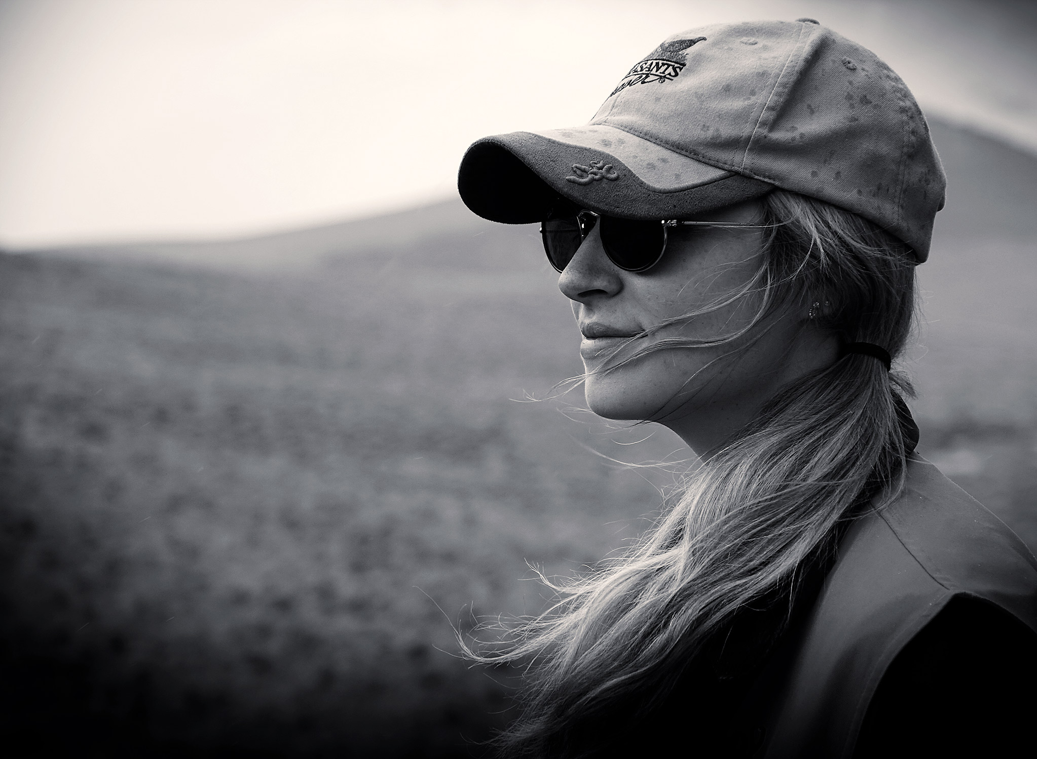 Female upland bird hunter in the field in Montana